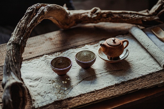 Traditional tea ceremony setting with teaware and warm lighting